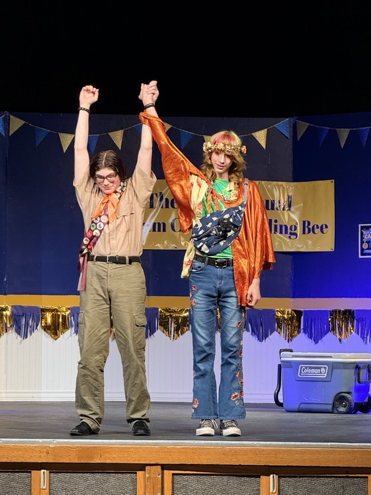 two cast members taking bow
