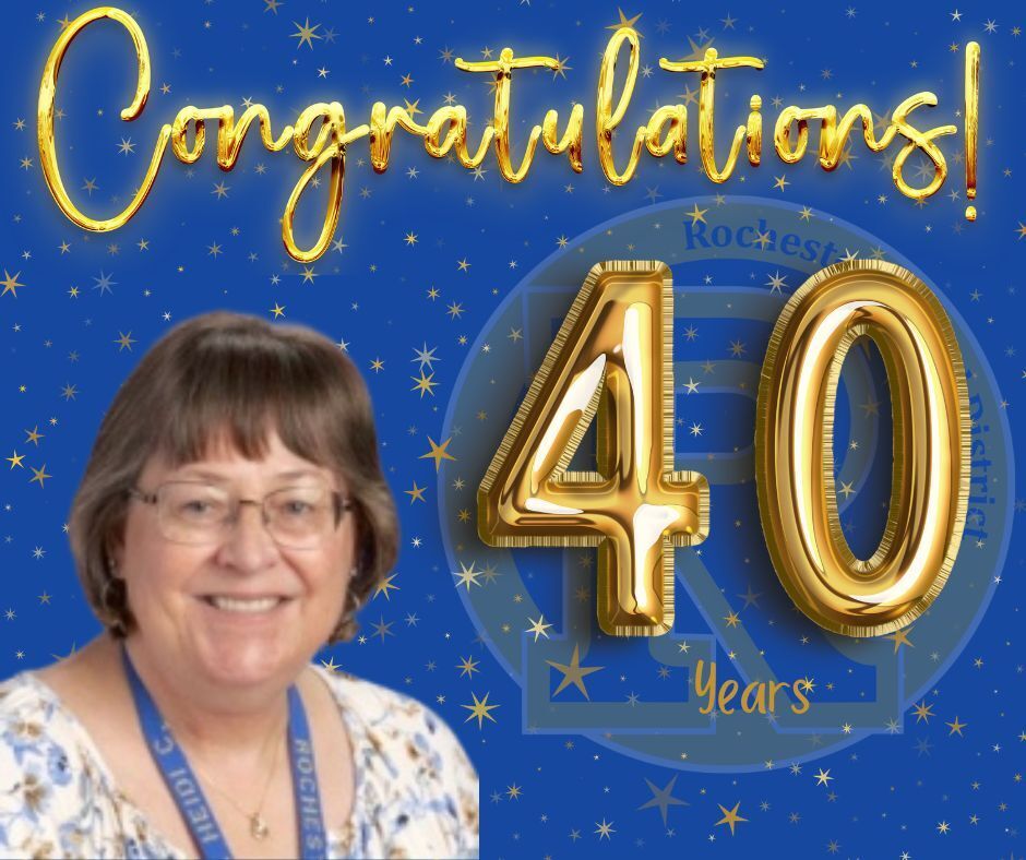 A woman wearing glasses smiles at the camera, with "Congratulations! 40 Years" in gold text on a blue background.