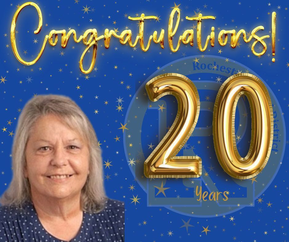 A woman smiles for a photo with a blue background. Gold text reads "Congratulations!" and "20 Years" with golden foil numbers.