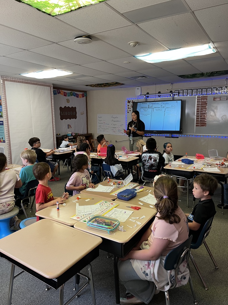 Mrs. Nino and her studetns completing a "Warrior Way" activity. 