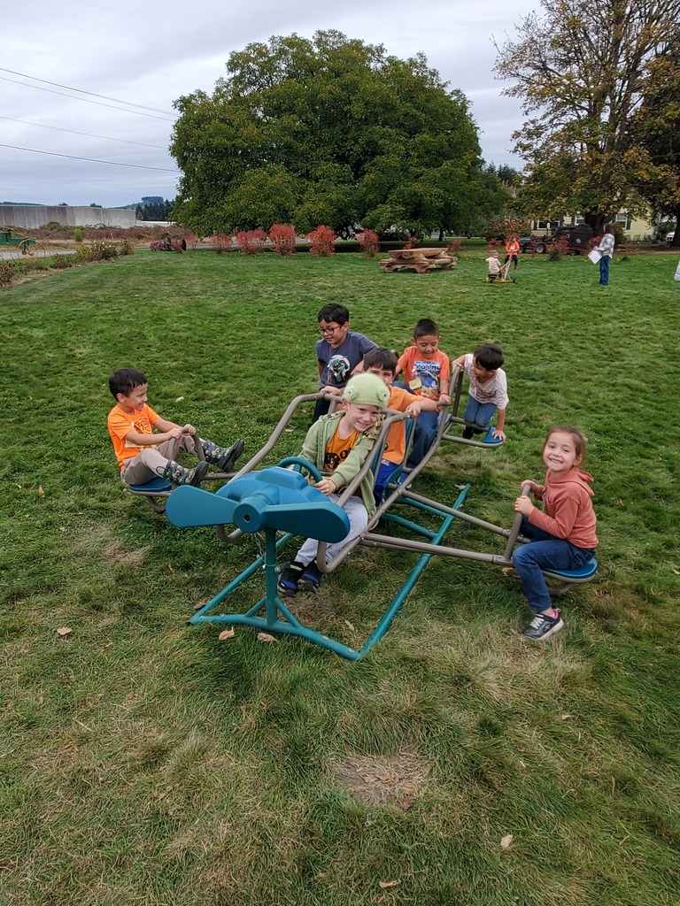 Kindergartners on toy plane.