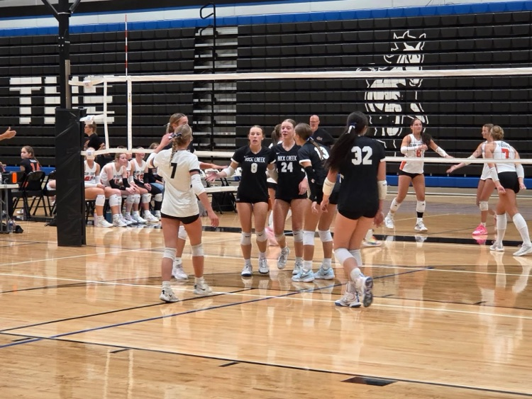HS VB celebrating after scoring vs Clay Center.
