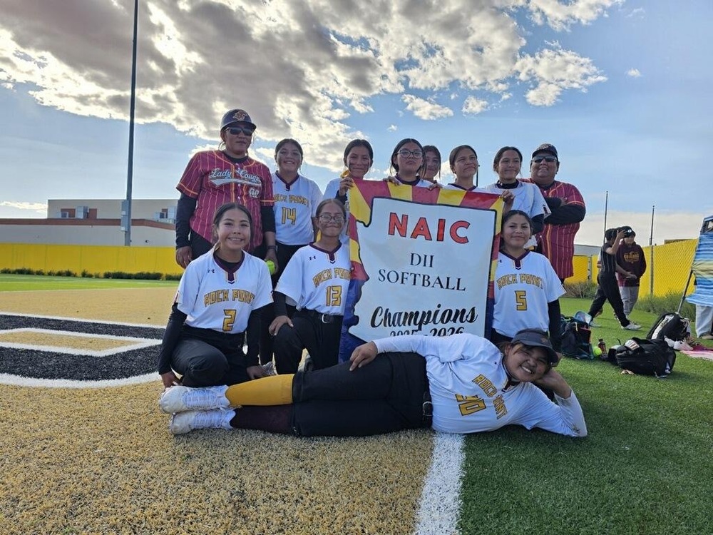 MS Softball team with championship banner