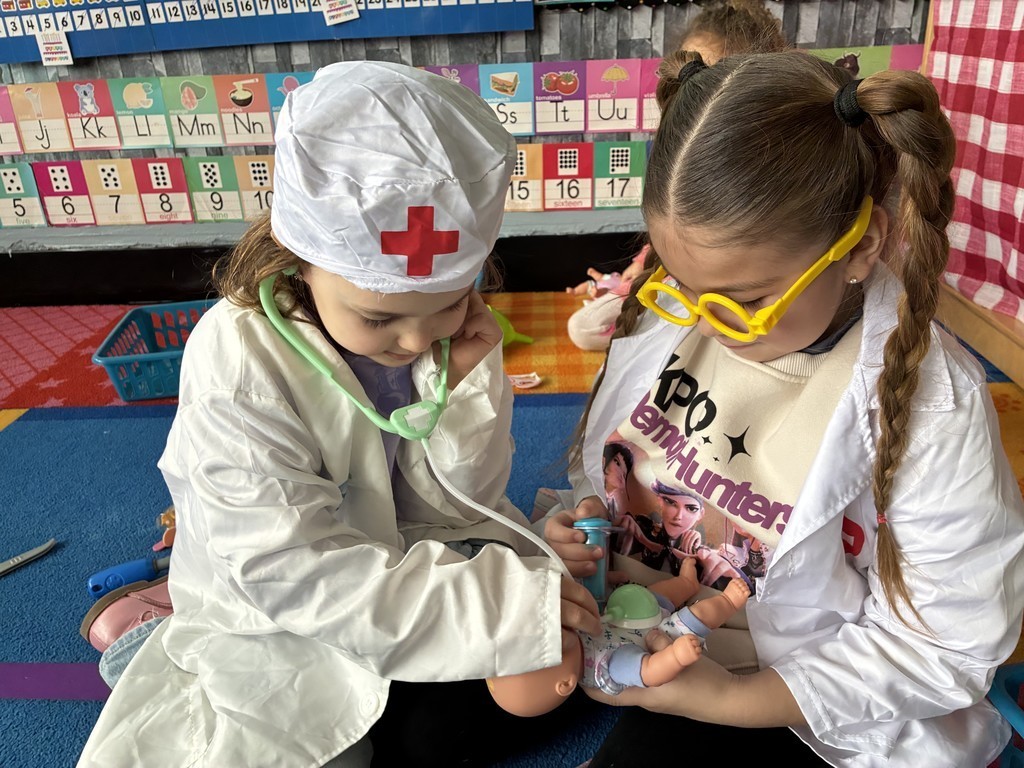 2 students dressed as future doctors 