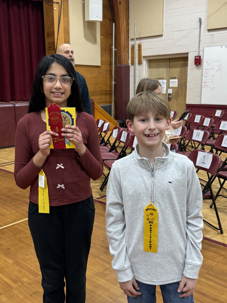 two students posing in the school auditorium for Please join us in congratulating Xavion S., Eloise S., Luca F., and Janya R. for making KDM proud with their outstanding performances in the GFWC Woman’s Club of the Denville–Rockaway Area Annual Spelling Bee. A very special shout out to Janya R., who achieved an amazing second-place finish for KDM!