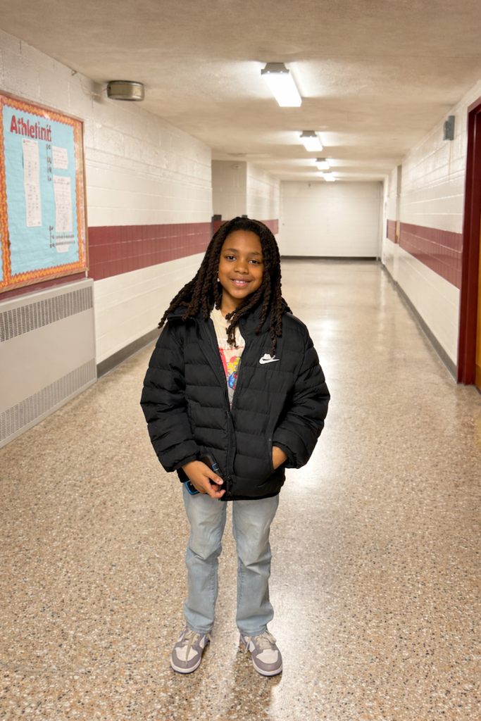 student posing in the school hallway = Please join us in congratulating Xavion S., Eloise S., Luca F., and Janya R. for making KDM proud with their outstanding performances in the GFWC Woman’s Club of the Denville–Rockaway Area Annual Spelling Bee. A very special shout out to Janya R., who achieved an amazing second-place finish for KDM! 