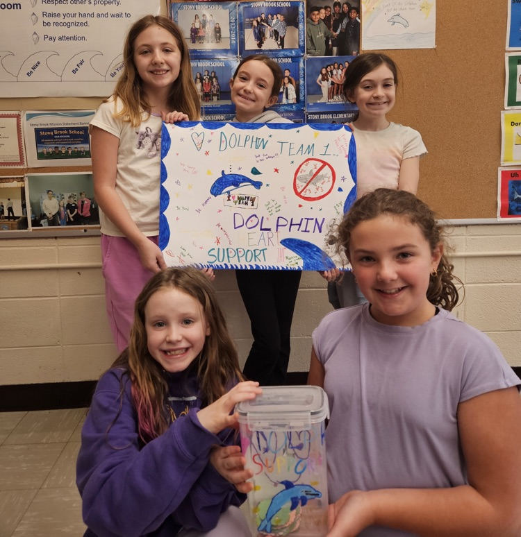 five female students posing with their decorated plastic jar and poster 