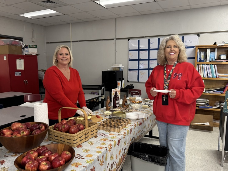 Teachers with apple bowls