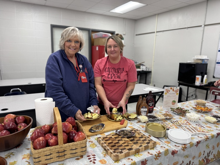 Teachers with apple bowls