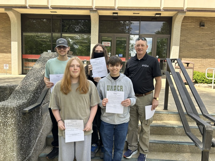 Students and teacher stand on steps at Somerset Community.  