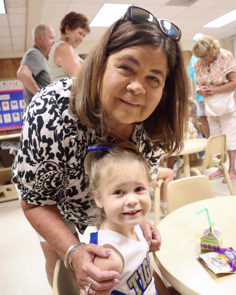 Grandmother with her grandchild, smiling