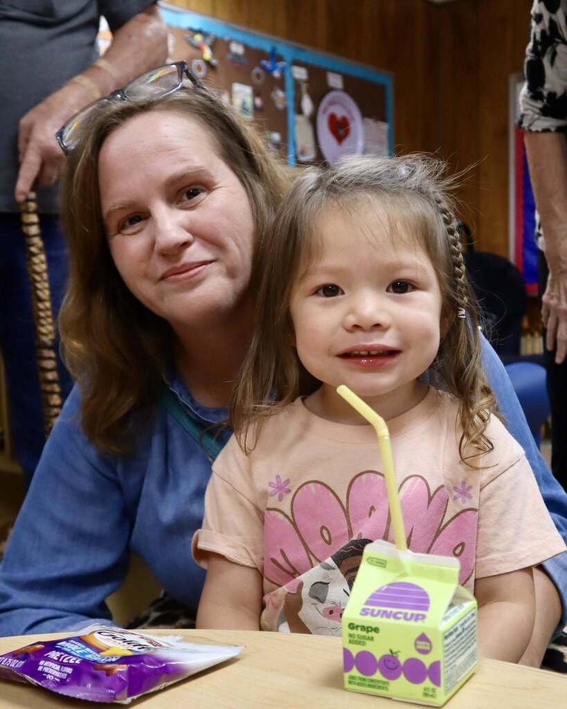 Grandmother with her grandchild, smiling