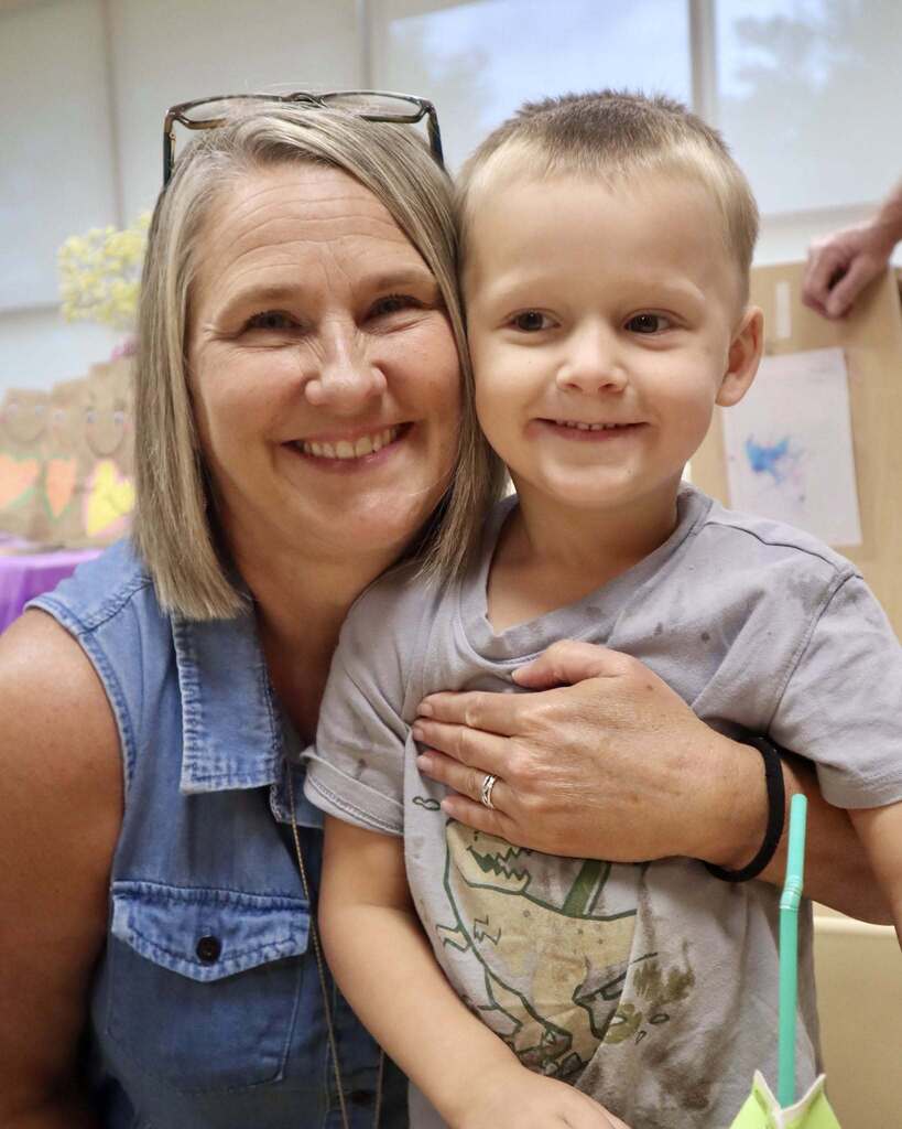 Grandmother with her grandchild, smiling