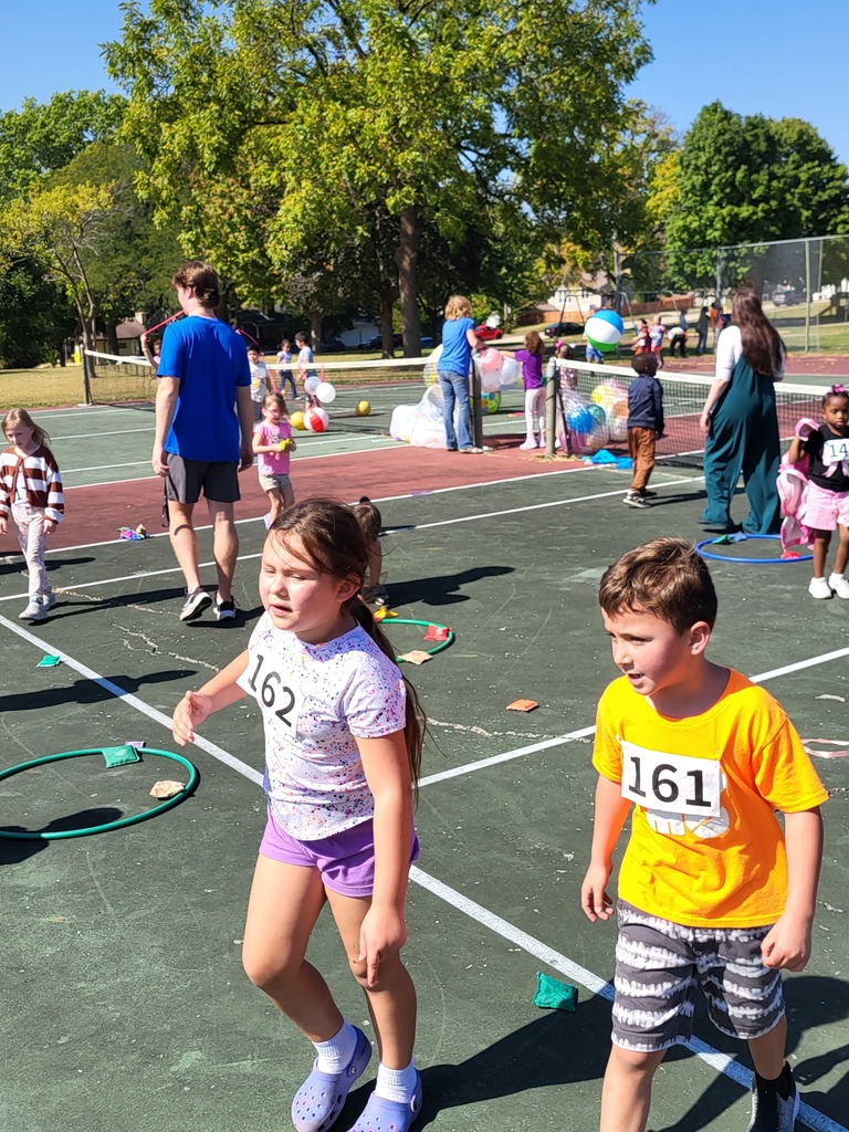Boy and girl students racing.