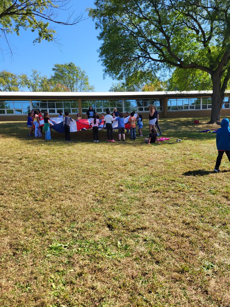Students playing with parachute.
