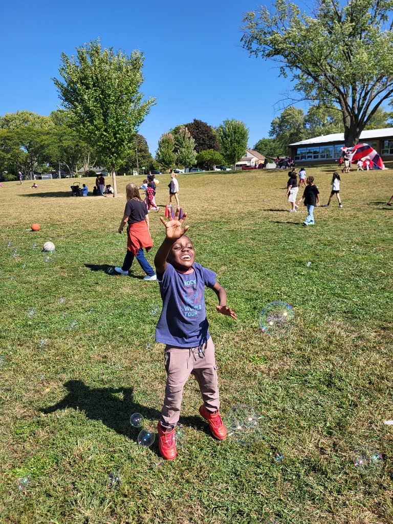 Boy playing with bubbles.