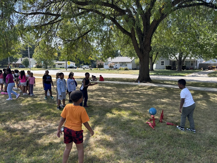 students playing skittles