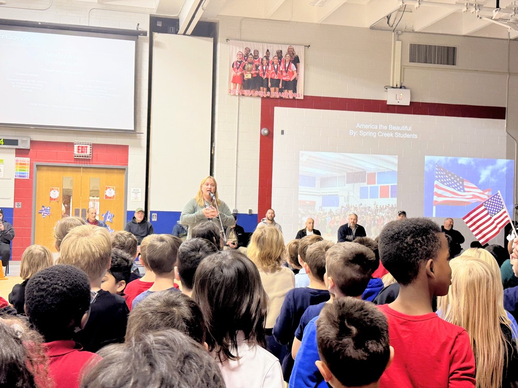 Mrs. Janitzky leading students in song.
