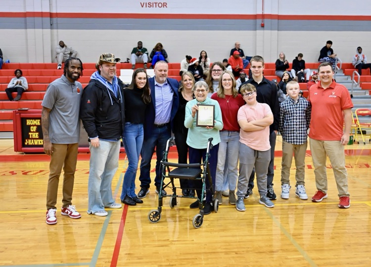 Buster Lindsay’s family with Head Coach LC Robinson and Athletic Director Zach Larson