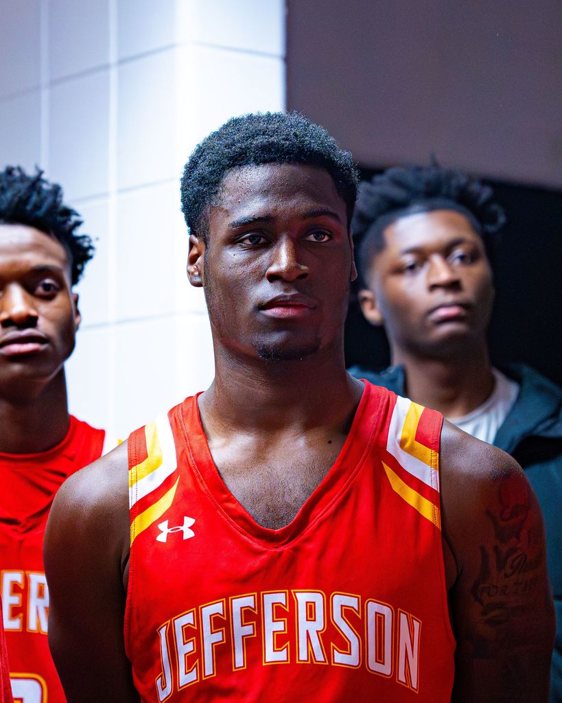 Three students looking off screen.