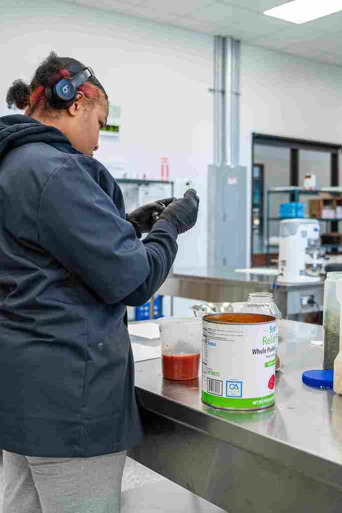 A student preparing their food before cooking.