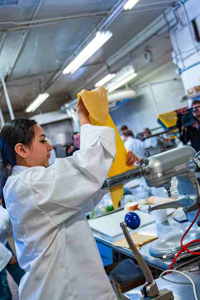 Student making pasta.
