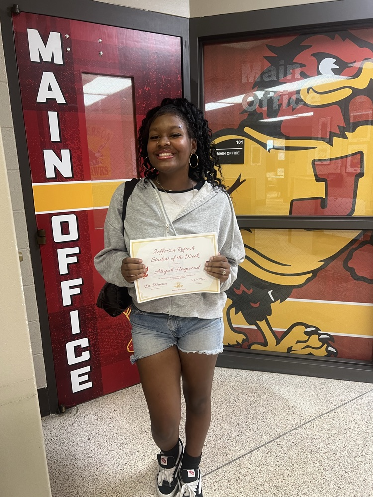Jefferson refresh student holds her certificate