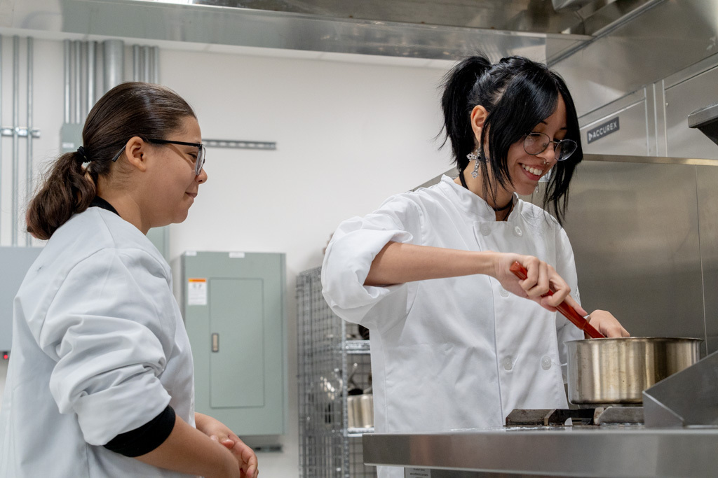 Two students are cooking.