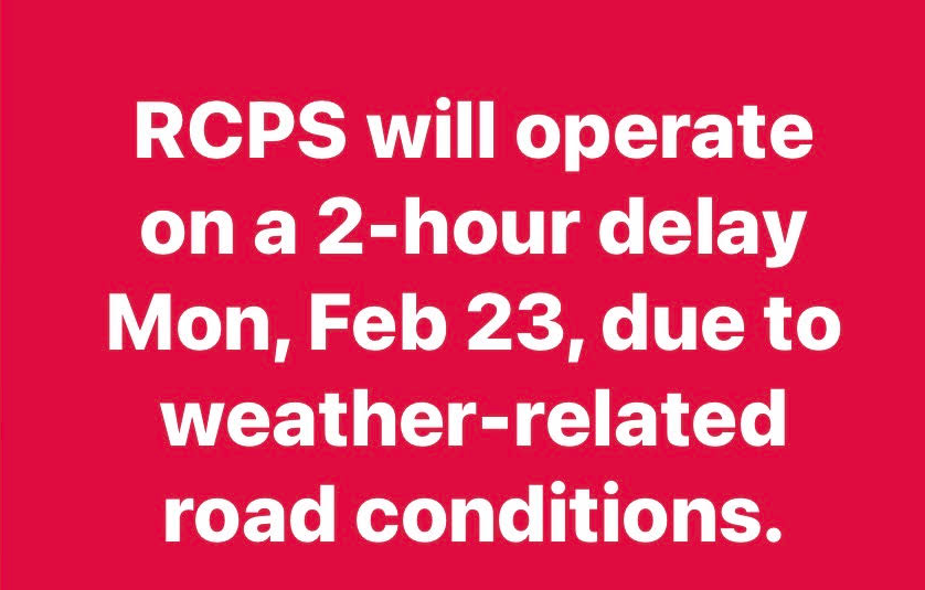 red sign with white letters announcing 2 hour delay for Monday february 23