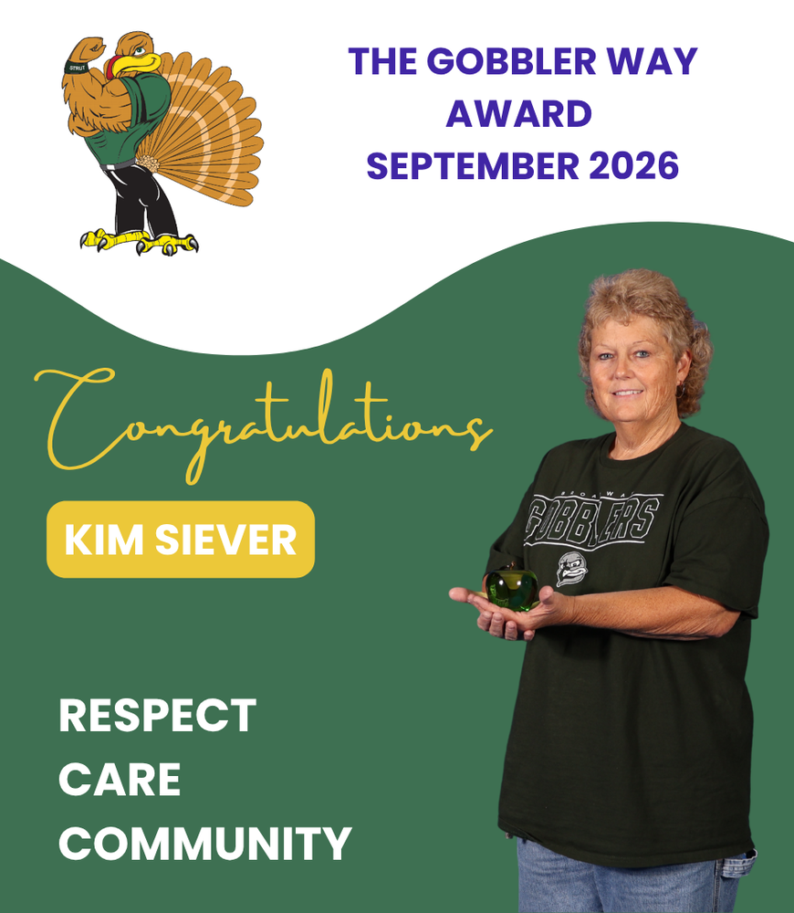 The  Gobbler Way Award - Kim  Siever holding the Green Apple as September's recipient