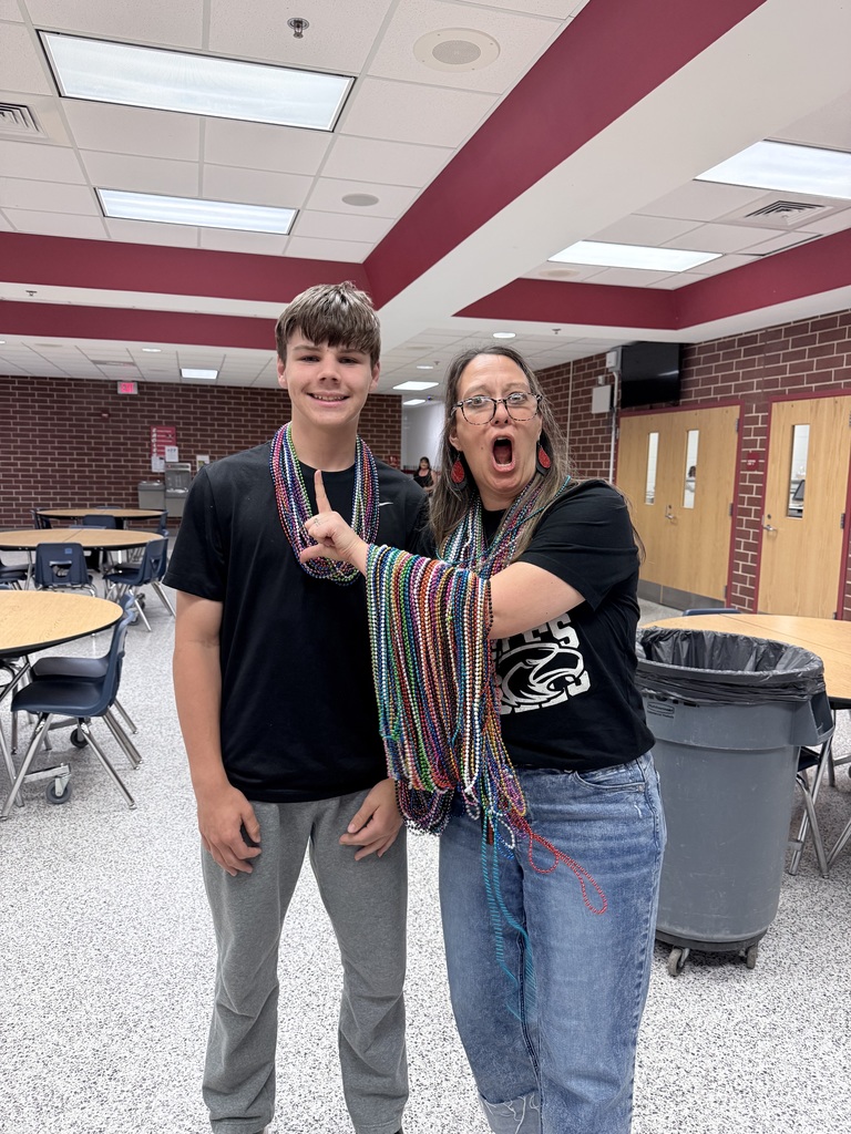 Peyton Kite and Mrs. McCrady with their colorful beads