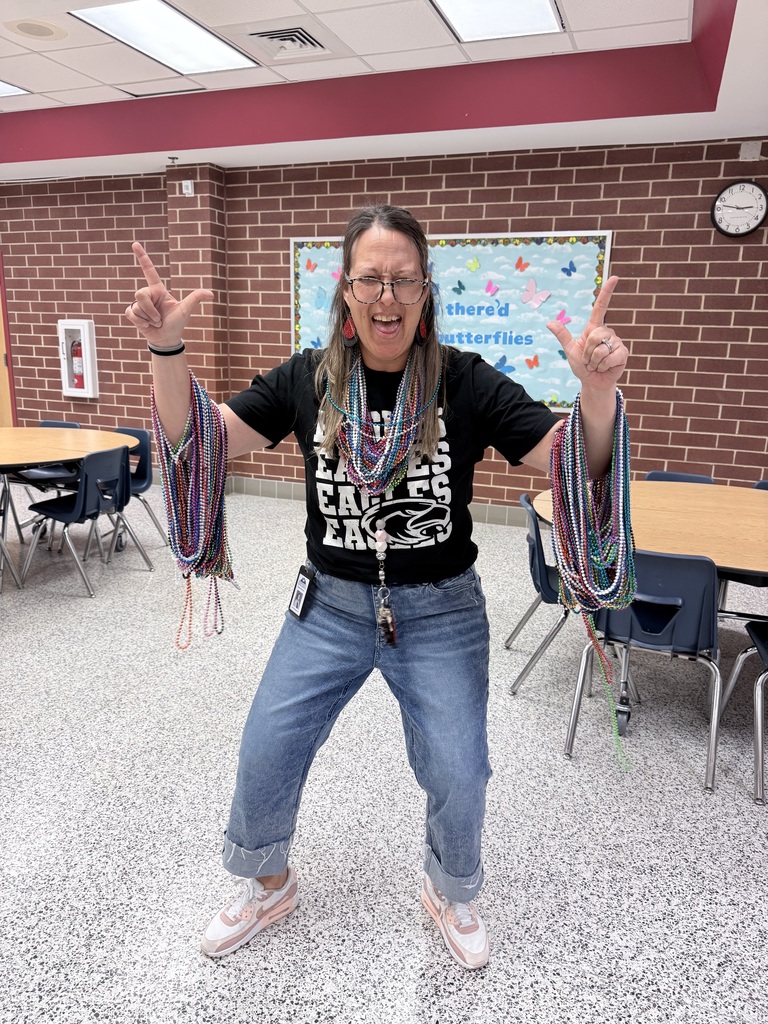 Mrs. McCrady posing with all her colorful necklaces