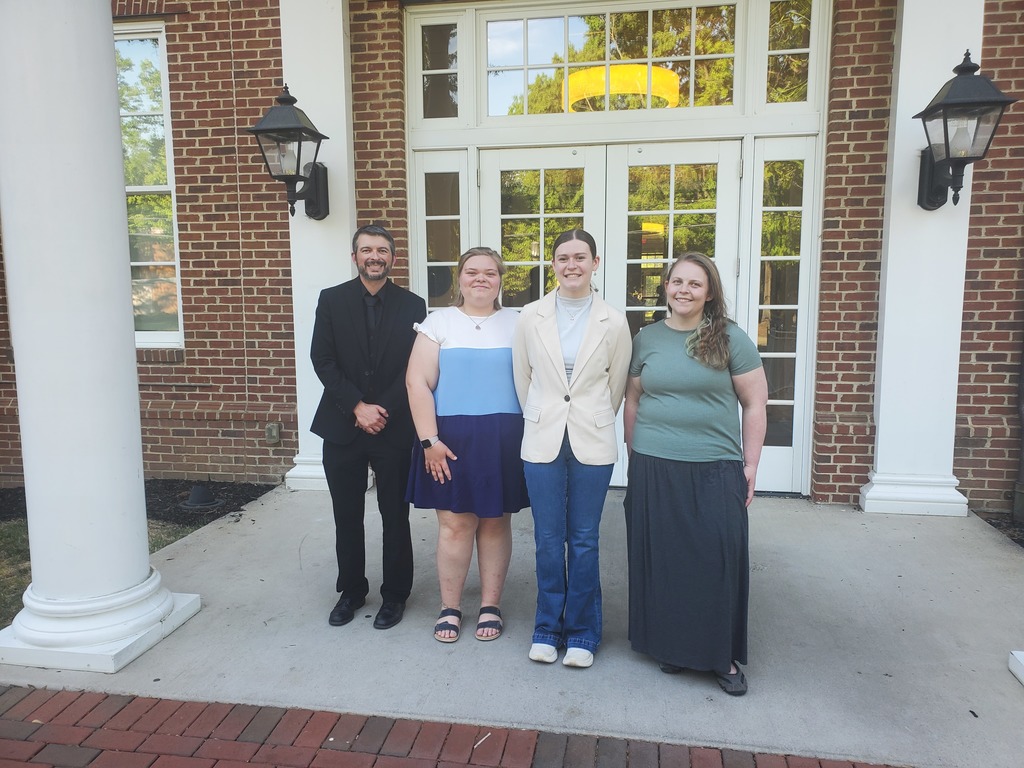 At the VHSL State Debate Tournament - From Left: Head Coach Steve O'Baugh, Gabbie Garlock, Caroline Carrier, and Assistant Coach Abbey Coleman
