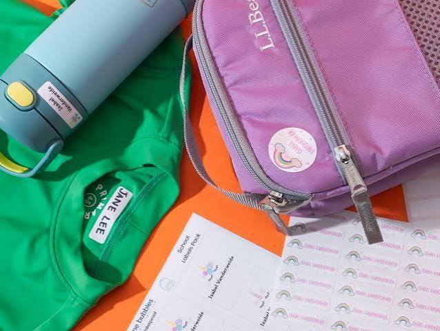 Items include a green t-shirt, a blue water bottle, a purple bag, and a piece of paper with printed text.