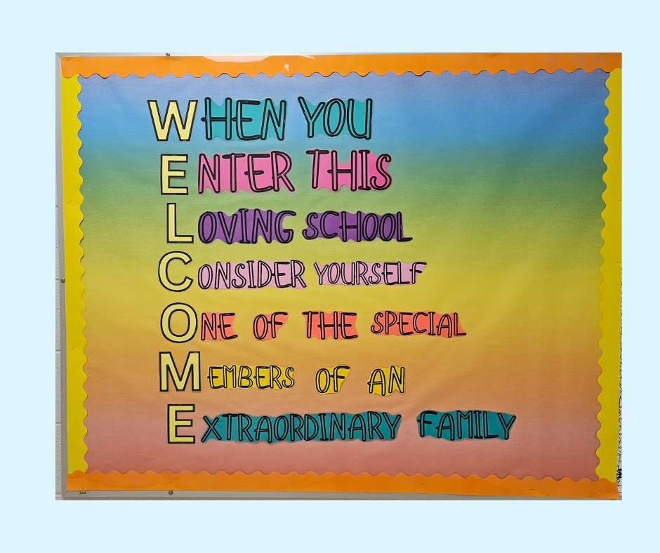 A colorful bulletin board with a rainbow background displays an uplifting message in vibrant, multicolored letters.