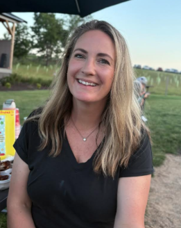 Mrs. Skelton in pictured in a park wearing a black shirt.