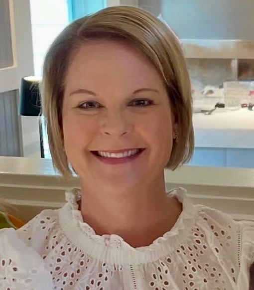 Ms. Knicely is pictured wearing a white lace top.