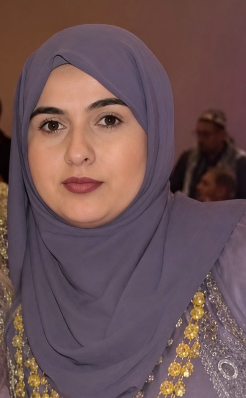 Mrs. Rostem is pictured wearing a gray hijab in her home. 