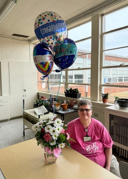 Woman Retiring with balloons