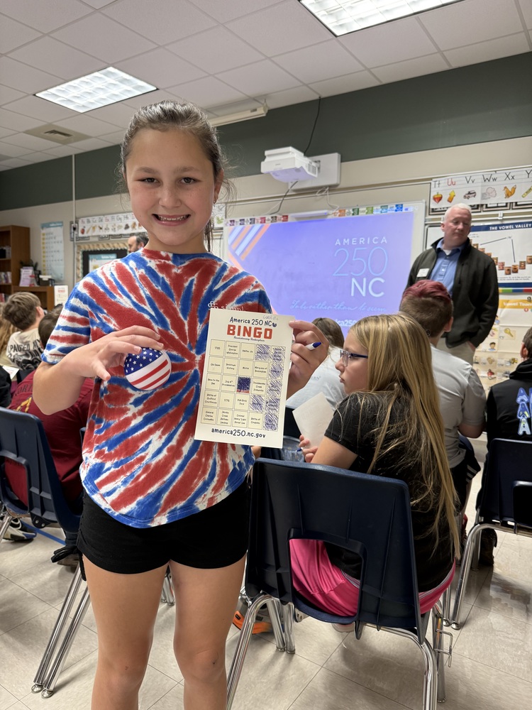 girl holding a bingo card