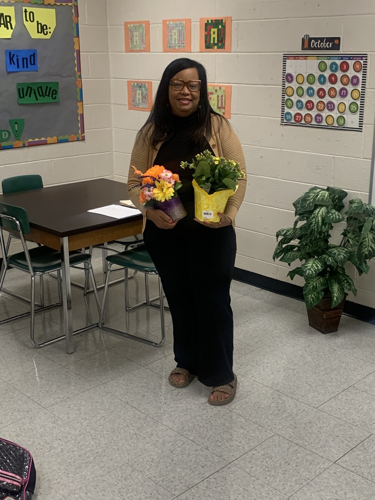 Teacher holding flowers