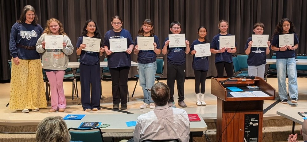 students holding certificates