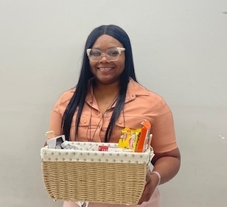 adult holding a basket