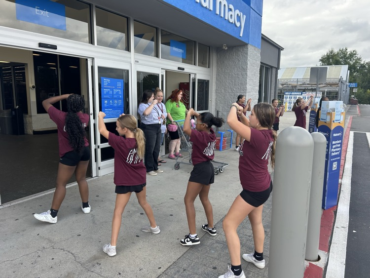 cheerleaders at stuff the bus