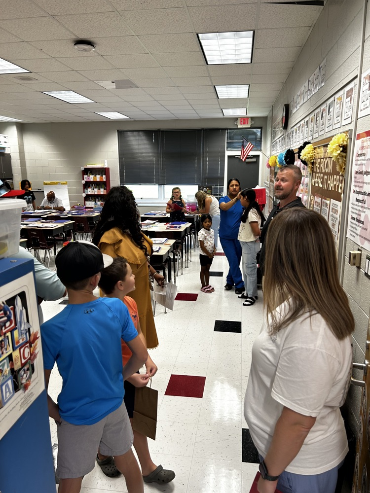 parents and students gather in new classroom