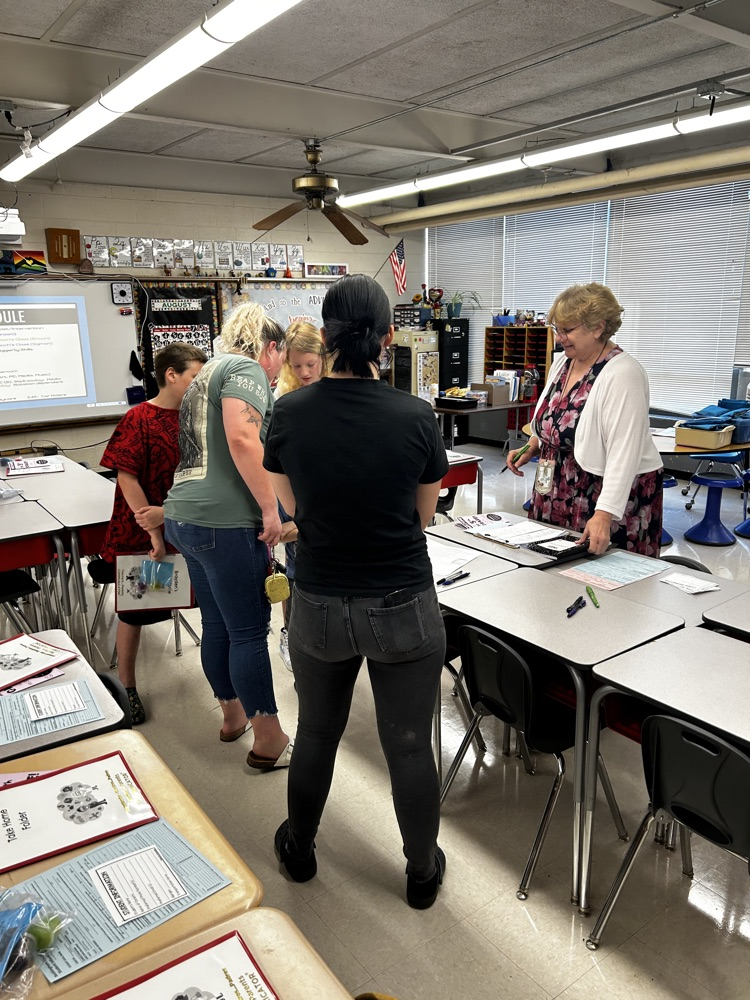 parents and students gather in new classroom