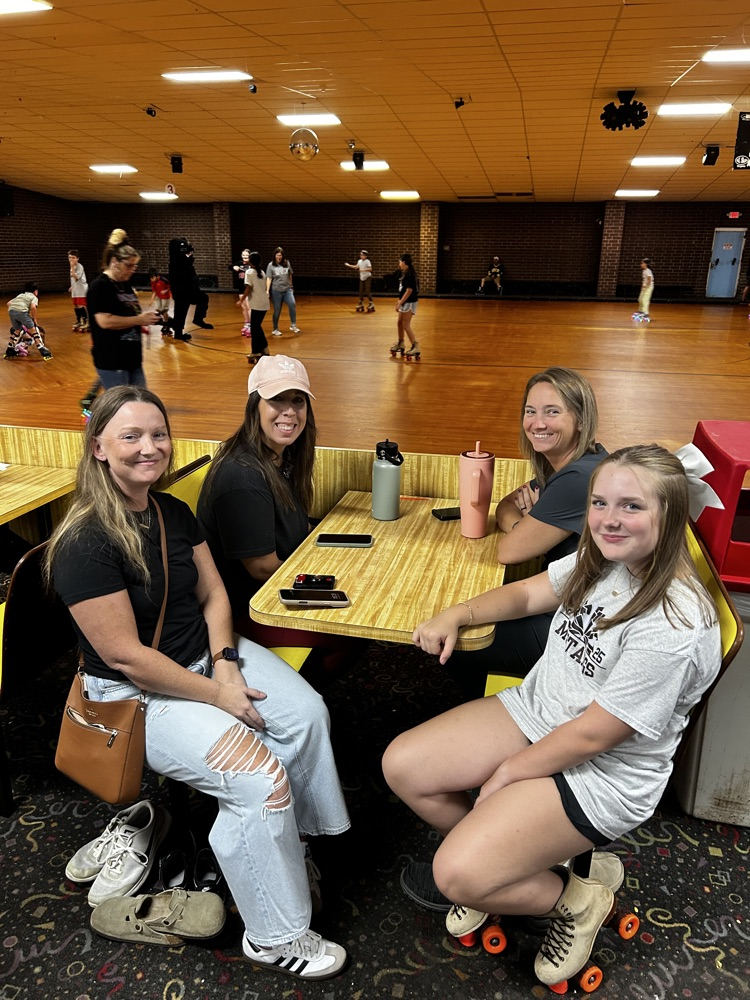 Staff, students and parents hang out at Skate Night. 