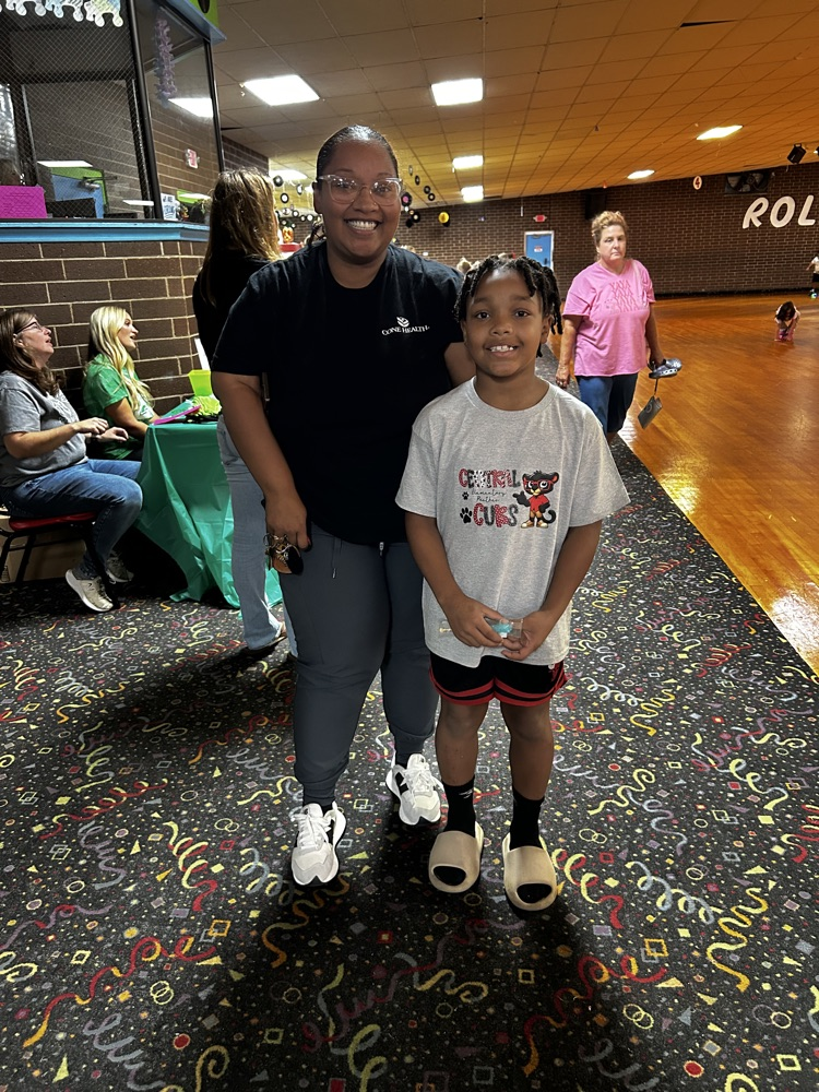 a parent and student take time to smile for the camera 
