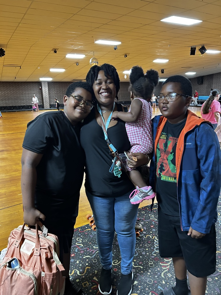 a family of four takes time to smile at the camera 