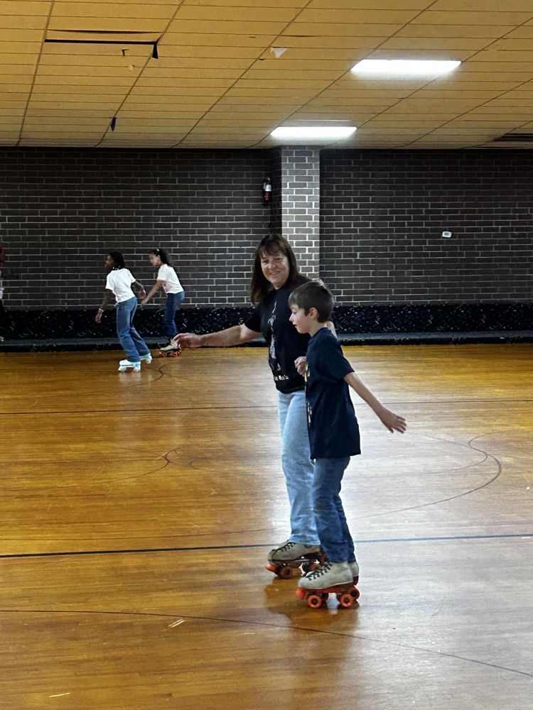 a mom and son skate together 